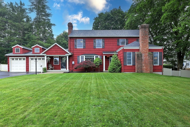 31 Meadowview Dr, Trumbull, CT 06611 - colonial home with a chimney, an attached garage, and driveway