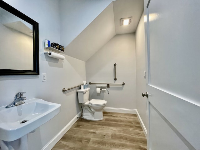 4 Armonk St, Greenwich, CT 06830 - bathroom with wood finished floors and lofted ceiling