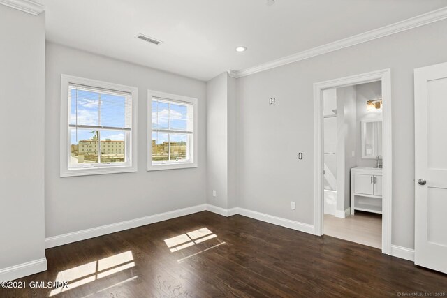 4 Armonk St, Greenwich, CT 06830 - unfurnished bedroom with crown molding, dark wood-style floors, ensuite bath, and recessed lighting
