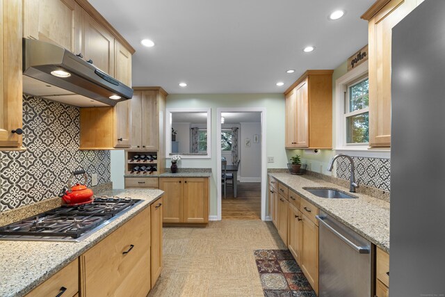 51 Carmel St, Hamden, CT 06518 - kitchen with appliances with stainless steel finishes, under cabinet range hood, tasteful backsplash, light stone counters, and light brown cabinetry