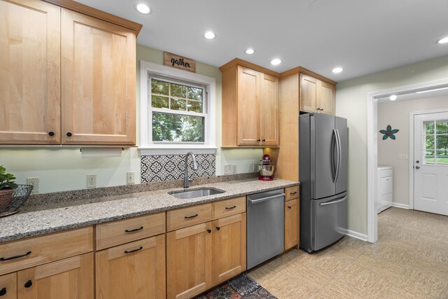 51 Carmel St, Hamden, CT 06518 - kitchen with stainless steel appliances, recessed lighting, light stone countertops, light brown cabinetry, and washer / clothes dryer