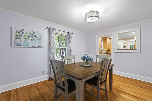 51 Carmel St, Hamden, CT 06518 - dining area featuring wood finished floors and ornamental molding