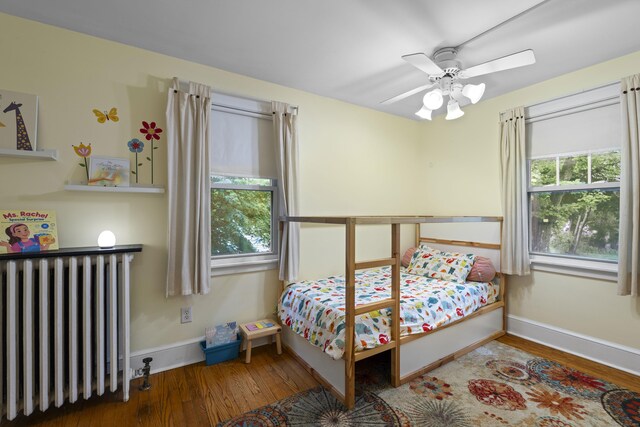 51 Carmel St, Hamden, CT 06518 - bedroom featuring radiator heating unit, wood finished floors, and a ceiling fan
