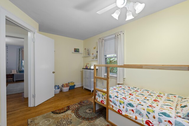 51 Carmel St, Hamden, CT 06518 - bedroom featuring radiator, wood finished floors, and a ceiling fan