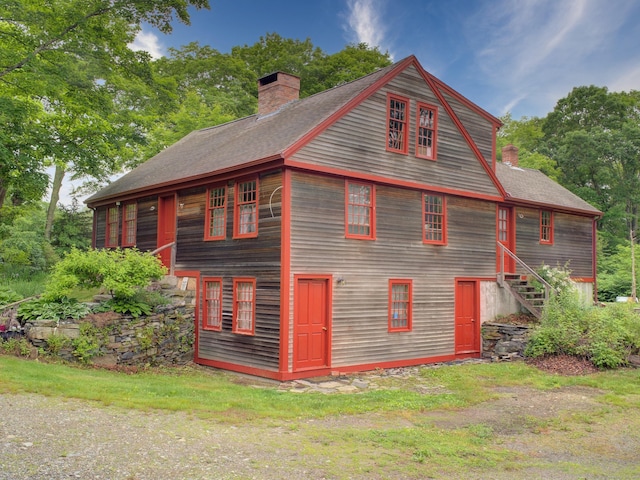 291 Cossaduck Hill Rd, North Stonington, CT 06359 - view of side of home featuring a chimney and roof with shingles