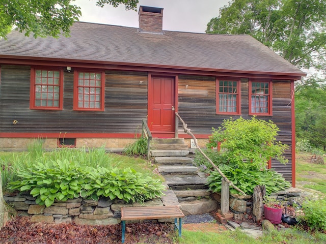 291 Cossaduck Hill Rd, North Stonington, CT 06359 - view of front of property featuring entry steps, a chimney, and a shingled roof