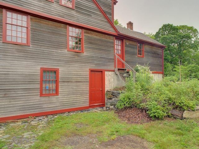 291 Cossaduck Hill Rd, North Stonington, CT 06359 - back of house featuring a chimney and entry steps