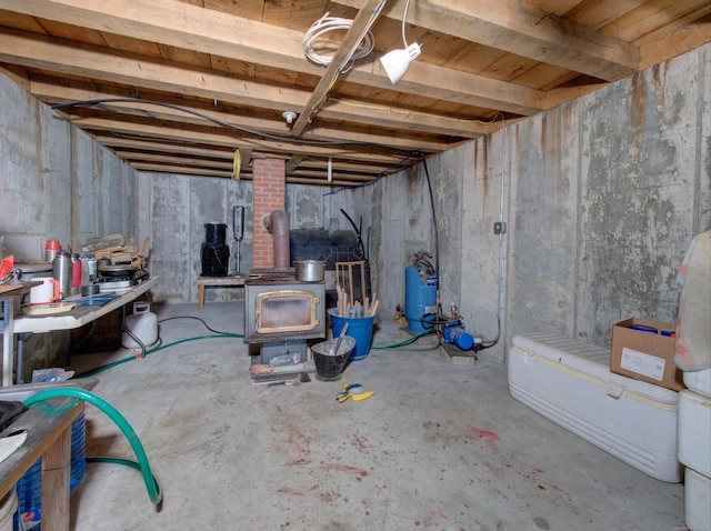 291 Cossaduck Hill Rd, North Stonington, CT 06359 - unfinished below grade area with a wood stove and a water pressure tank