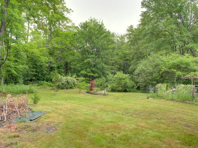 291 Cossaduck Hill Rd, North Stonington, CT 06359 - view of grassy yard featuring a wooded view