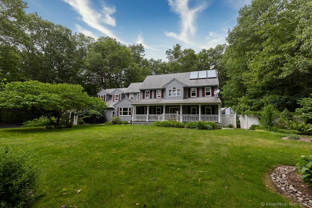 328 Old Marlborough Tpke, Portland, CT 06480 - view of front of home with roof mounted solar panels, a porch, and view of wooded area