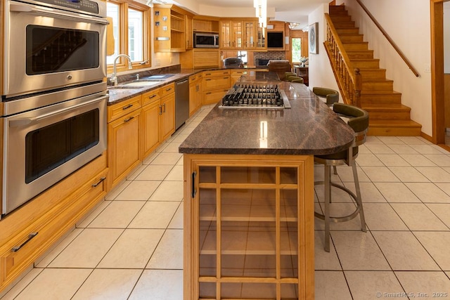 328 Old Marlborough Tpke, Portland, CT 06480 - kitchen with appliances with stainless steel finishes, open shelves, a breakfast bar, and light tile patterned floors