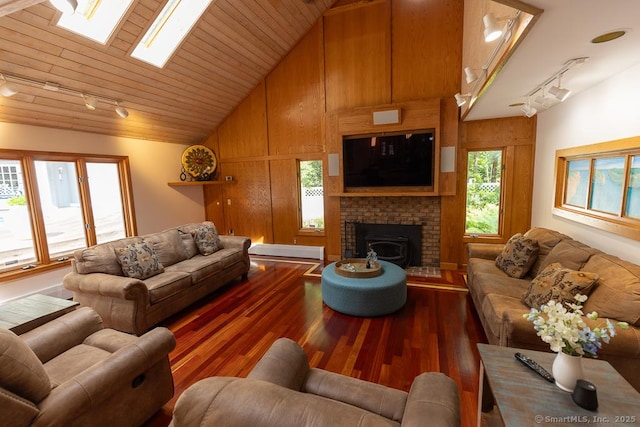 328 Old Marlborough Tpke, Portland, CT 06480 - living area featuring rail lighting, vaulted ceiling, wood finished floors, a brick fireplace, and wood ceiling