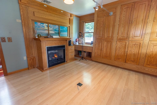 328 Old Marlborough Tpke, Portland, CT 06480 - living area with light wood-style flooring and a warm lit fireplace