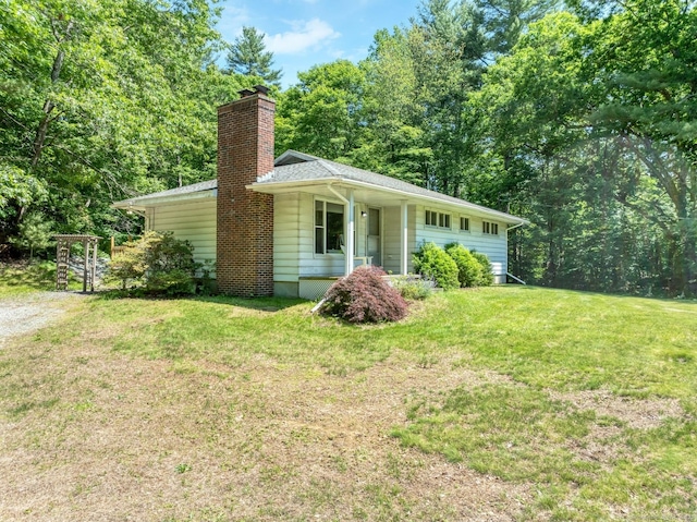 123 Geer Rd, Griswold, CT 06351 - view of front facade with a front lawn and a chimney
