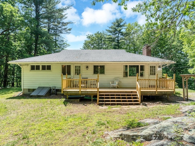 123 Geer Rd, Griswold, CT 06351 - rear view of property with a chimney, a yard, a wooden deck, and roof with shingles