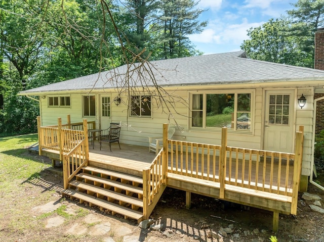 123 Geer Rd, Griswold, CT 06351 - back of property featuring a shingled roof, a chimney, and a wooden deck