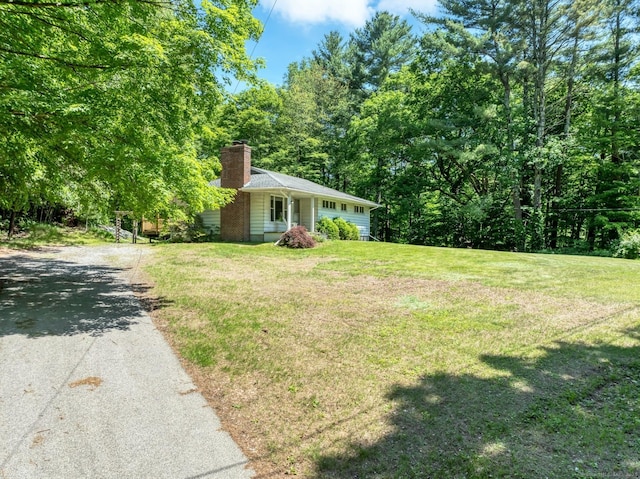 123 Geer Rd, Griswold, CT 06351 - view of front of house featuring a chimney, driveway, and a front yard