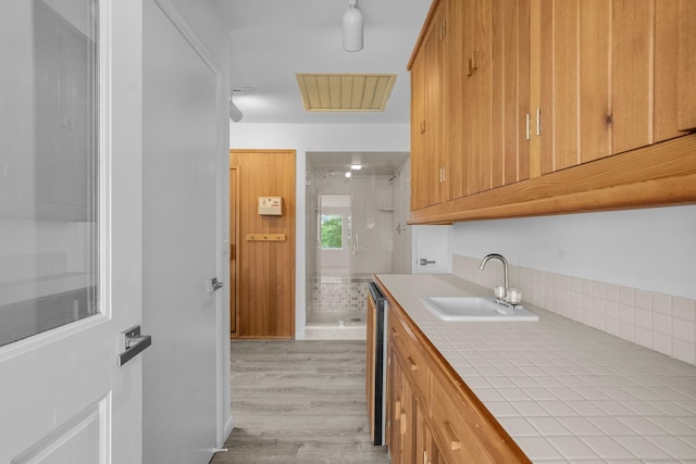 162 Shortwoods Rd, New Fairfield, CT 06812 - kitchen featuring tile countertops, light wood-type flooring, and stainless steel dishwasher