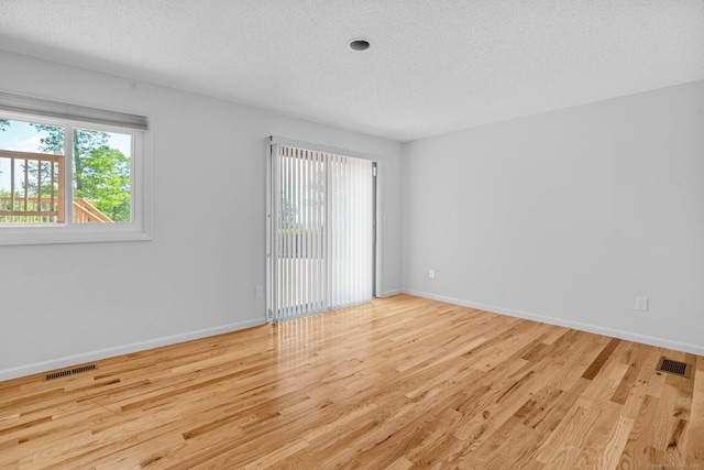 162 Shortwoods Rd, New Fairfield, CT 06812 - empty room with wood finished floors and a textured ceiling