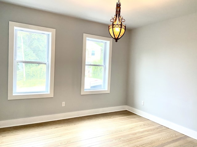 218 Charles St, Waterbury, CT 06708 - unfurnished room with healthy amount of natural light and wood finished floors