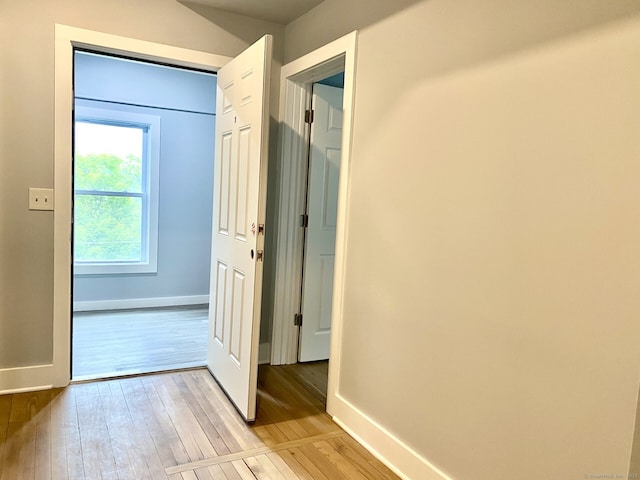 218 Charles St, Waterbury, CT 06708 - corridor featuring light wood-style floors and baseboards