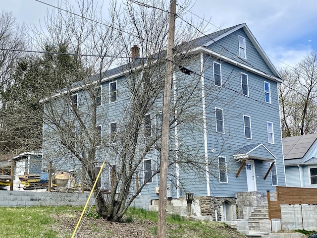 218 Charles St, Waterbury, CT 06708 - view of home's exterior with a chimney