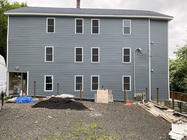218 Charles St, Waterbury, CT 06708 - rear view of house with a chimney