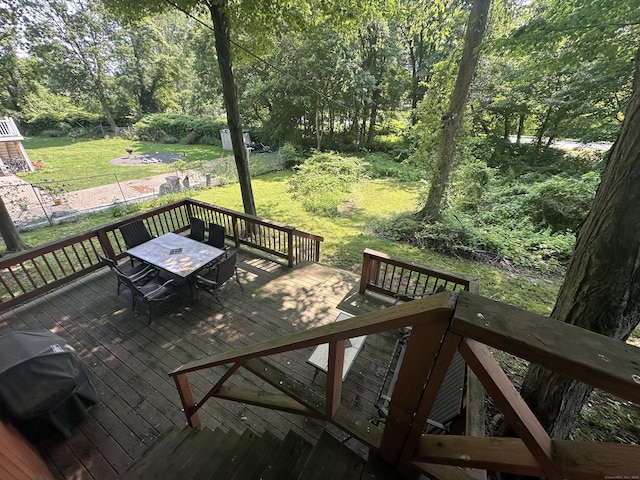 813 Russell St, New Haven, CT 06513 - wooden deck with outdoor dining area, a lawn, grilling area, and a view of trees