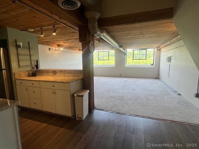 68 Thermos Ave Unit 206B, Norwich, CT 06360 - bar featuring dark wood-style flooring, wood ceiling, freestanding refrigerator, and track lighting