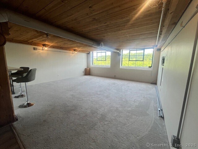 68 Thermos Ave Unit 206B, Norwich, CT 06360 - carpeted empty room with wood ceiling