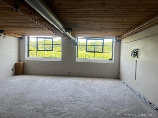 68 Thermos Ave Unit 206B, Norwich, CT 06360 - carpeted spare room with wooden ceiling