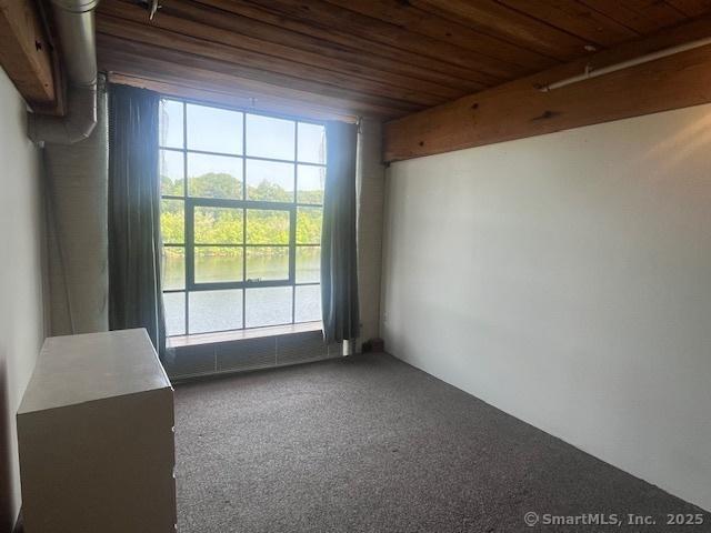 68 Thermos Ave Unit 206B, Norwich, CT 06360 - spare room featuring wooden ceiling and carpet flooring