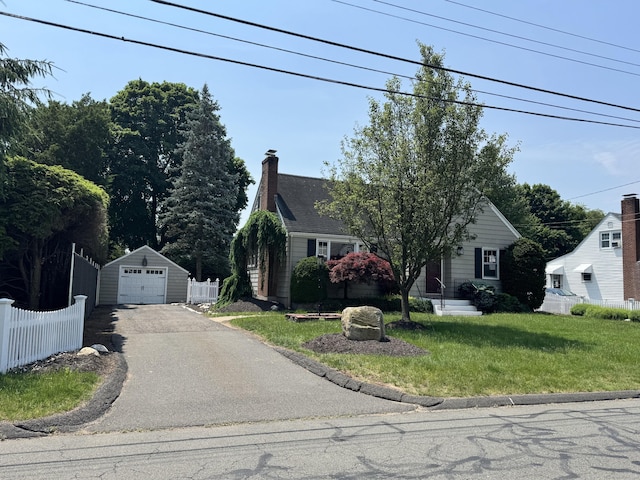3 Fairview Hts, Cromwell, CT 06416 - view of front of house featuring driveway, a detached garage, an outdoor structure, and a chimney