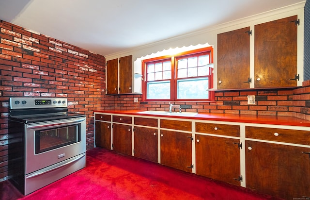 3 Fairview Hts, Cromwell, CT 06416 - kitchen with stainless steel electric stove, brick wall, dark carpet, ornamental molding, and light countertops