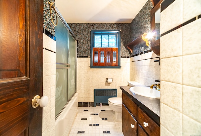 3 Fairview Hts, Cromwell, CT 06416 - full bath featuring radiator heating unit, tile patterned flooring, vanity, enclosed tub / shower combo, and tile walls