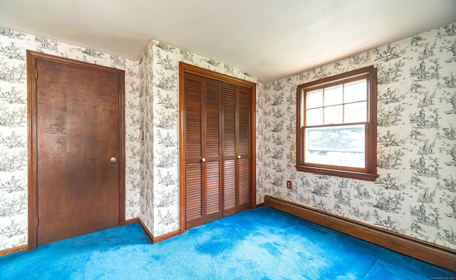 3 Fairview Hts, Cromwell, CT 06416 - unfurnished bedroom featuring a closet, carpet floors, baseboard heating, and wallpapered walls