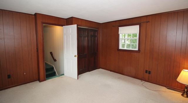 154 Sandy Ln, Meriden, CT 06450 - unfurnished bedroom featuring carpet flooring, wooden walls, and a closet