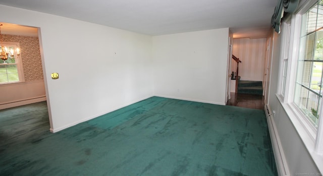 154 Sandy Ln, Meriden, CT 06450 - carpeted empty room featuring a chandelier, stairway, a baseboard heating unit, and healthy amount of natural light