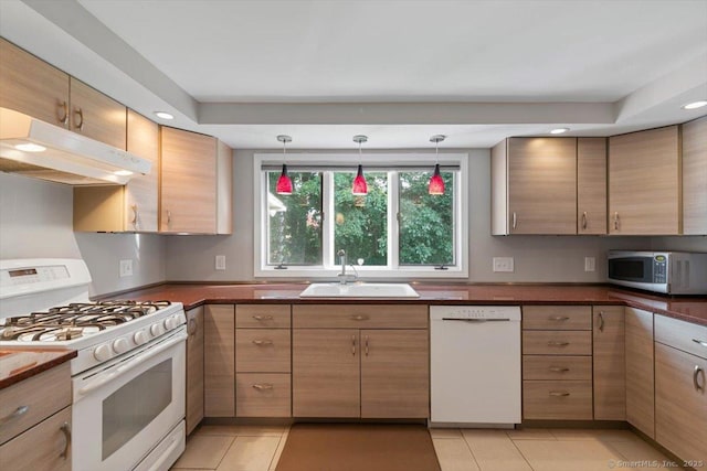 60 Ranch Rd, Milford, CT 06460 - kitchen featuring white appliances, under cabinet range hood, dark countertops, light tile patterned floors, and pendant lighting