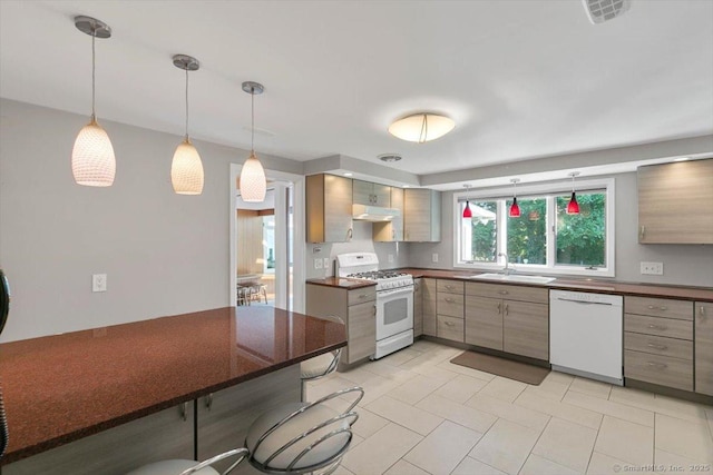 60 Ranch Rd, Milford, CT 06460 - kitchen with white appliances, dark countertops, and pendant lighting