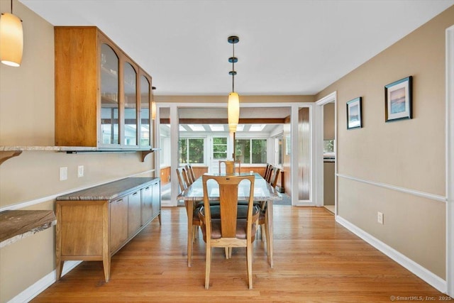 60 Ranch Rd, Milford, CT 06460 - dining room featuring light wood-style floors and baseboards