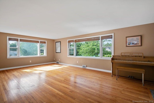 60 Ranch Rd, Milford, CT 06460 - unfurnished living room with baseboards and wood-type flooring