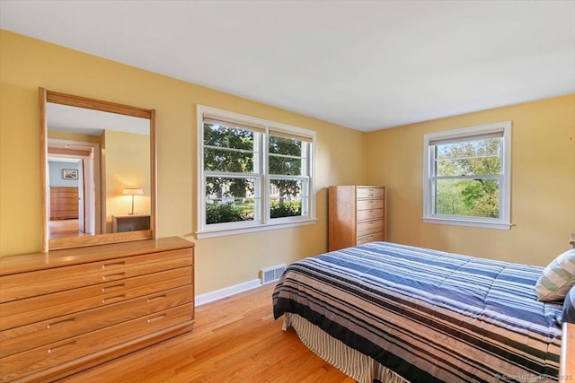 60 Ranch Rd, Milford, CT 06460 - bedroom featuring multiple windows and light wood finished floors