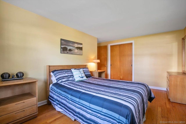 60 Ranch Rd, Milford, CT 06460 - bedroom with baseboards and wood finished floors