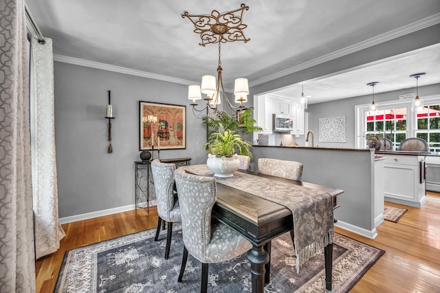 31 Country Way, Madison, CT 06443 - dining space featuring a chandelier, light wood-style floors, and ornamental molding