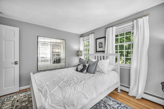 31 Country Way, Madison, CT 06443 - bedroom featuring wood finished floors and a baseboard radiator