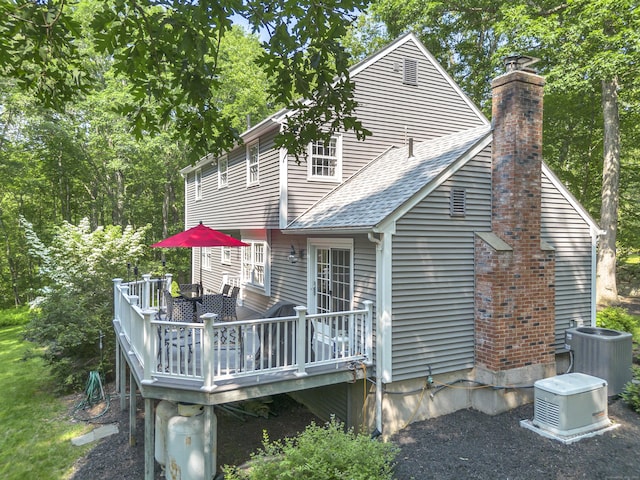 31 Country Way, Madison, CT 06443 - rear view of property featuring a deck, a chimney, and a shingled roof
