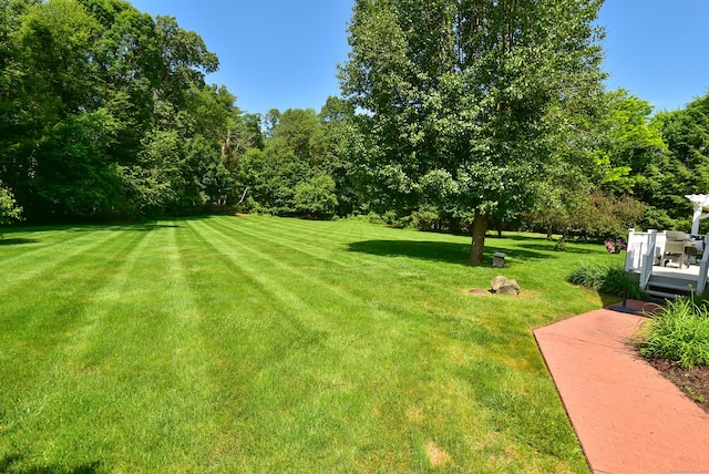16 Brookfield Dr, Ellington, CT 06029 - view of green lawn featuring a deck