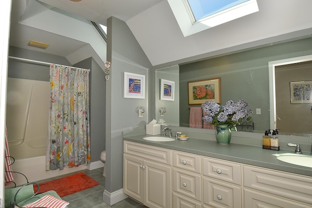 16 Brookfield Dr, Ellington, CT 06029 - bathroom with double vanity, a skylight, lofted ceiling, tile patterned floors, and shower / bath combo with shower curtain