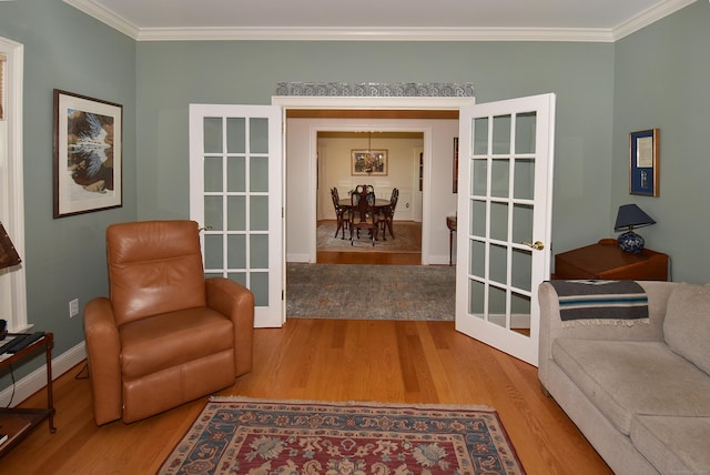 16 Brookfield Dr, Ellington, CT 06029 - sitting room featuring wood finished floors, crown molding, and french doors